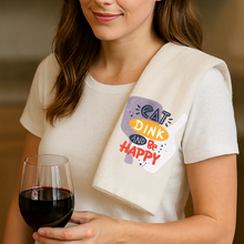 Woman holding a printed pickleball bar towel and a glass of red wine
