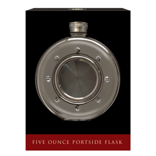 Round porthole-style hip flask in its black presentation box