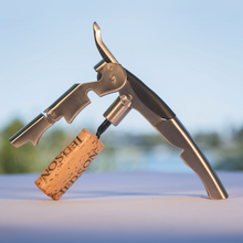 Stainless steel ratchet corkscrew with a drawn cork still attached