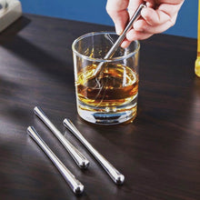Stainless steel stircicles beside a glass of whisky