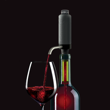 VinOstream aerator fitted to a wine bottle beside a filled glass