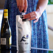 Woman filling a VinoGo pouch from a wine bottle