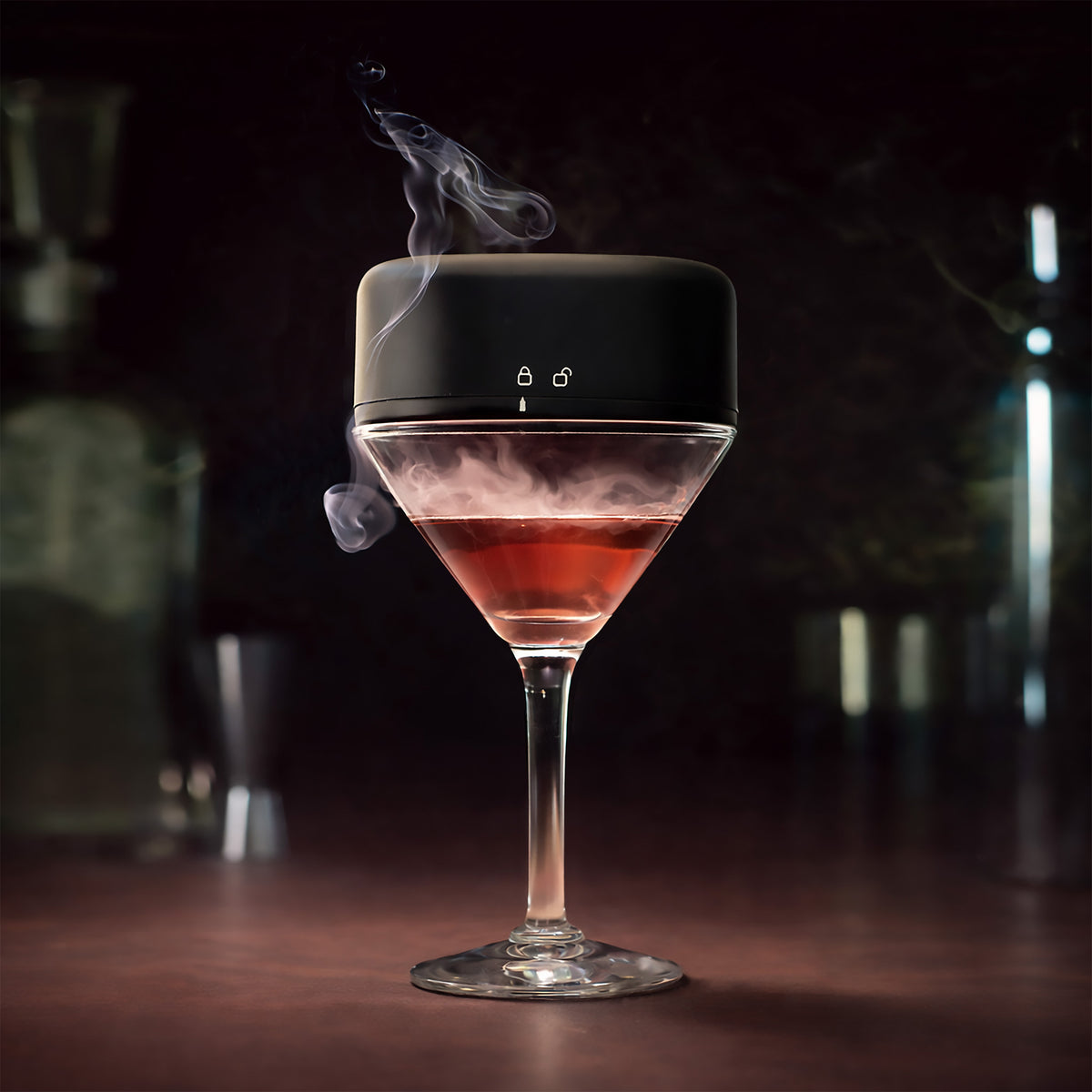 Smoke settling over a cocktail in a coupe glass