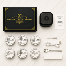 Electric cocktail smoker kit laid out with lids, wood chips and tools