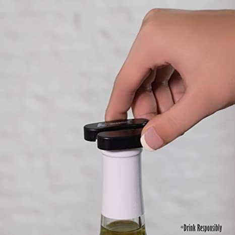 Hand twisting the Giovanni foil cutter over a wine bottle top